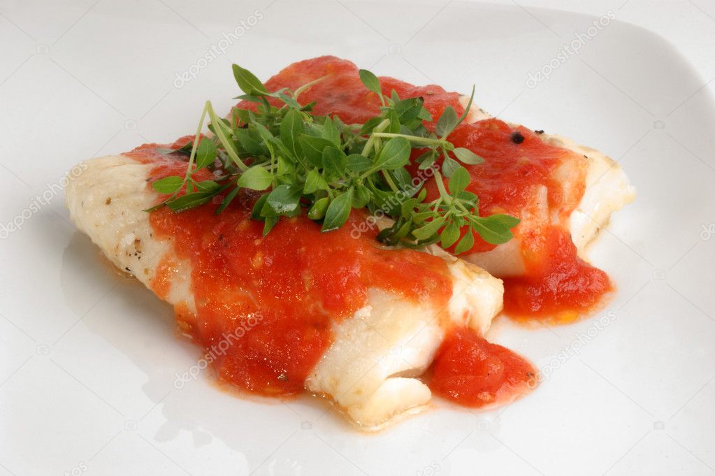 Cooked cod loins with tomato sauce