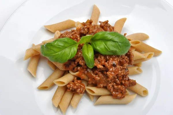 Pasta with mince sauce and basil — Stock Photo, Image
