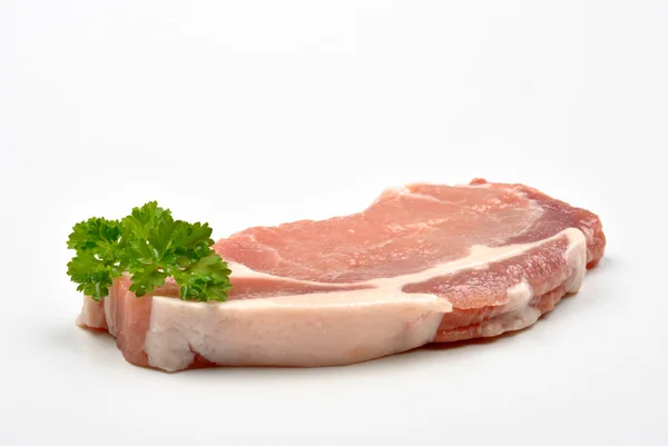 Bio-Schweinekotelett und Petersilie — Stockfoto