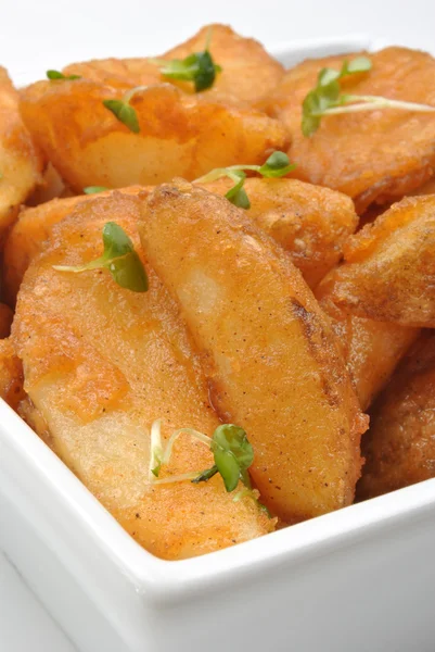Alcuni spicchi di patate fritte — Foto Stock