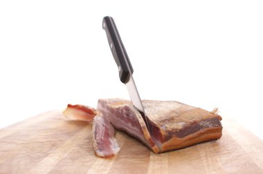 Smoked bacon on a timberboard clipart