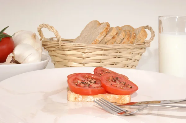Tomato cut into slice on a bread — Stock Photo, Image