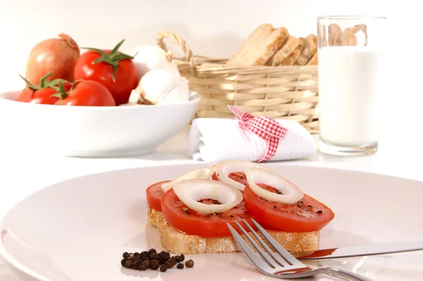 Tomato cut into slice on a bread — Stock Photo, Image