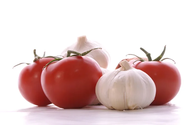 Garlic and tomatos — Stock Photo, Image