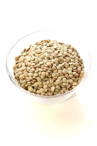 Dried lentils in a glas bowl — Stock Photo, Image