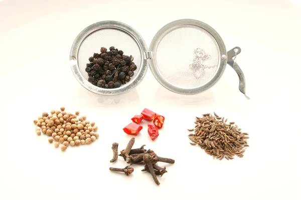 Spiceball and some spices — Stock Photo, Image