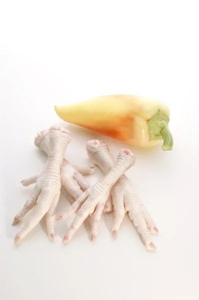 Chicken feet and paprika — Stock Photo, Image