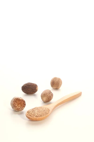 Nutmeg also some nutmeg powder — Stock Photo, Image