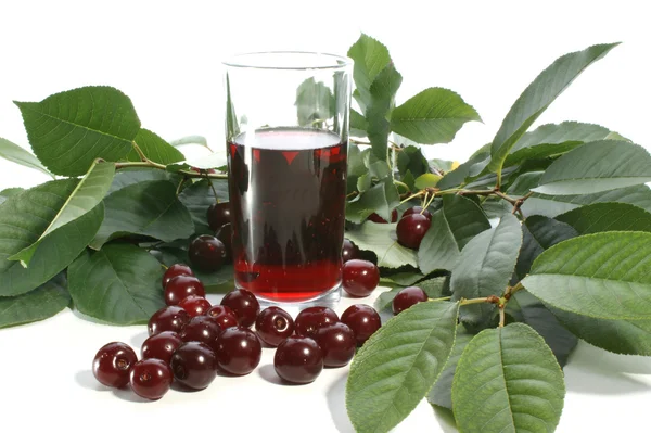 Cherry juice and red cherries — Stock Photo, Image