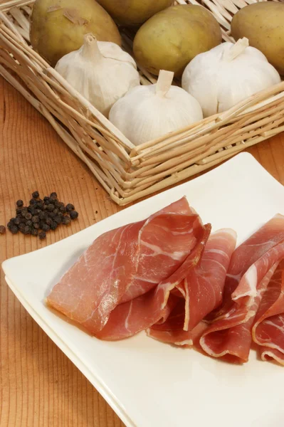 Smoked ham on a white plate — Stock Photo, Image