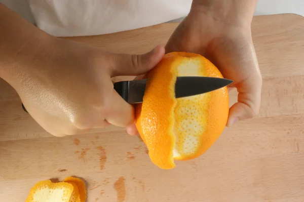 Peel one organic orange — Stock Photo, Image