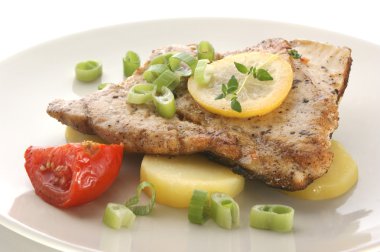 Carp fillet with potato, tomato clipart