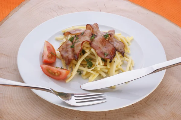Pasta with tomato and bacon — Stock Photo, Image