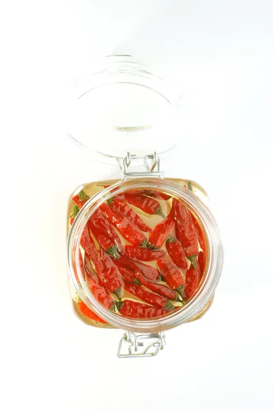 Biologische rode chili in een pot — Stockfoto