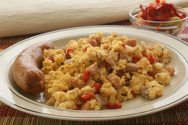 Stock image Scrambled eggs with organic tomato