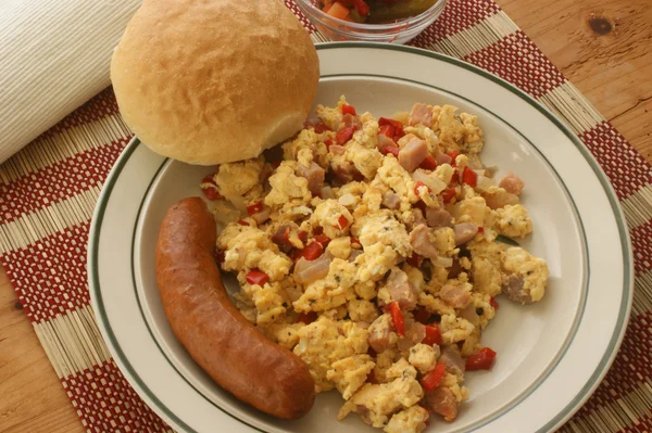 stock image Scrambled eggs with organic tomato