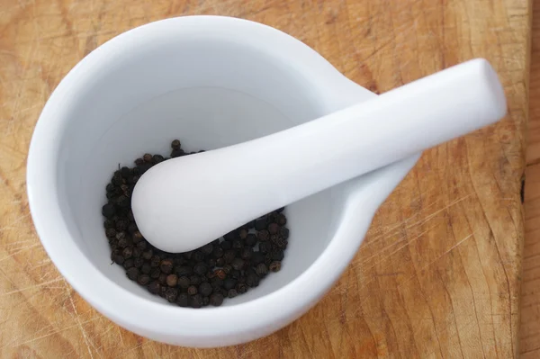 stock image Pounding black organic pepper