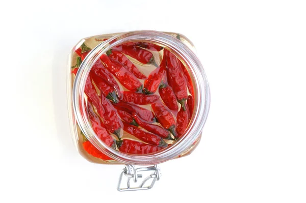 Biologische rode chili in een pot — Stockfoto