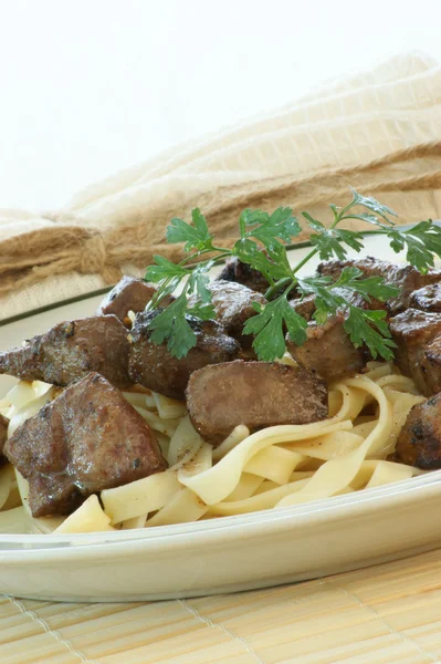 Liver goulash on pasta — Stock Photo, Image