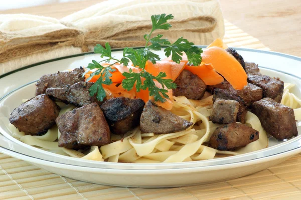 Liver goulash on pasta — Stock Photo, Image