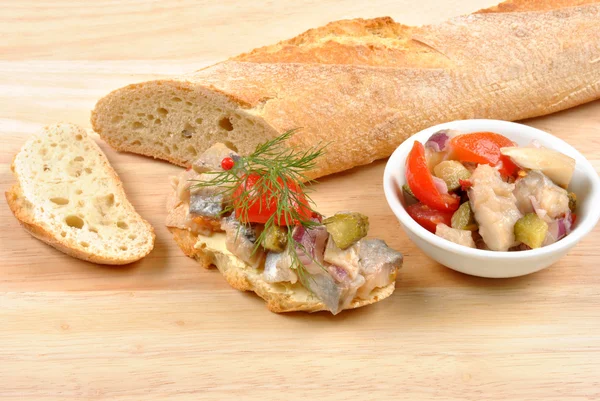 Herring salad and some bread — Stock Photo, Image