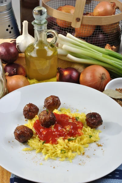 Meatballs with organic curry rice — Stock Photo, Image