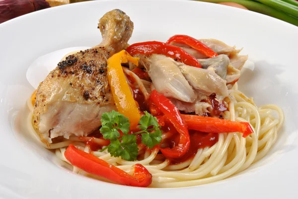 Spaghetti with grilled chicken wing — Stock Photo, Image