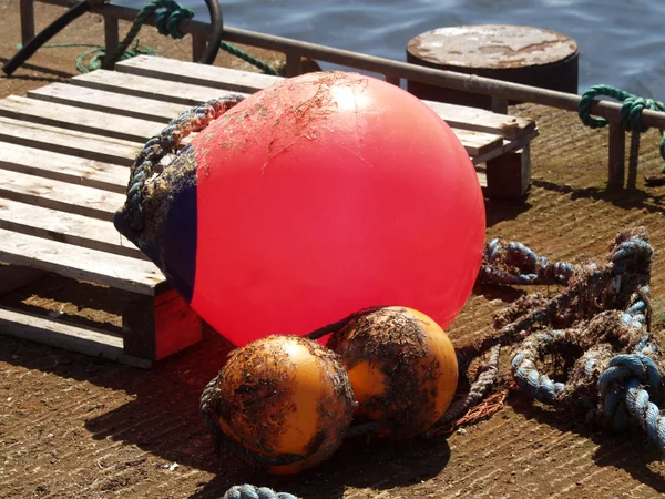 Red buoy and some rope — Stock Photo, Image