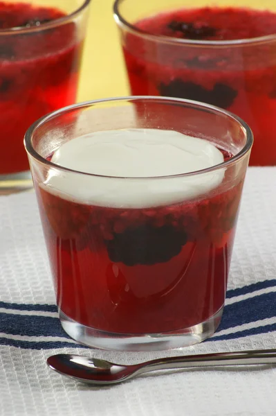Fruit jelly with cream in a glass — Stock Photo, Image