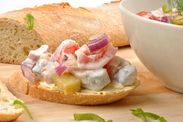 Fresh organic herring salad on bread — Stock Photo, Image