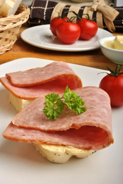 Bread roll with organic ham — Stock Photo, Image