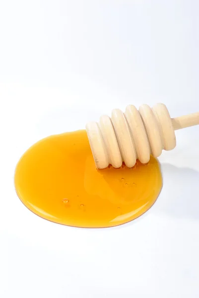 A honey spoon and honey — Stock Photo, Image