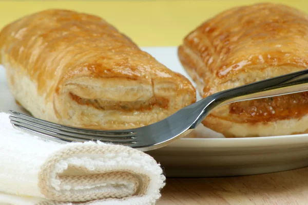 Sausage rolls on a plate — Stock Photo, Image
