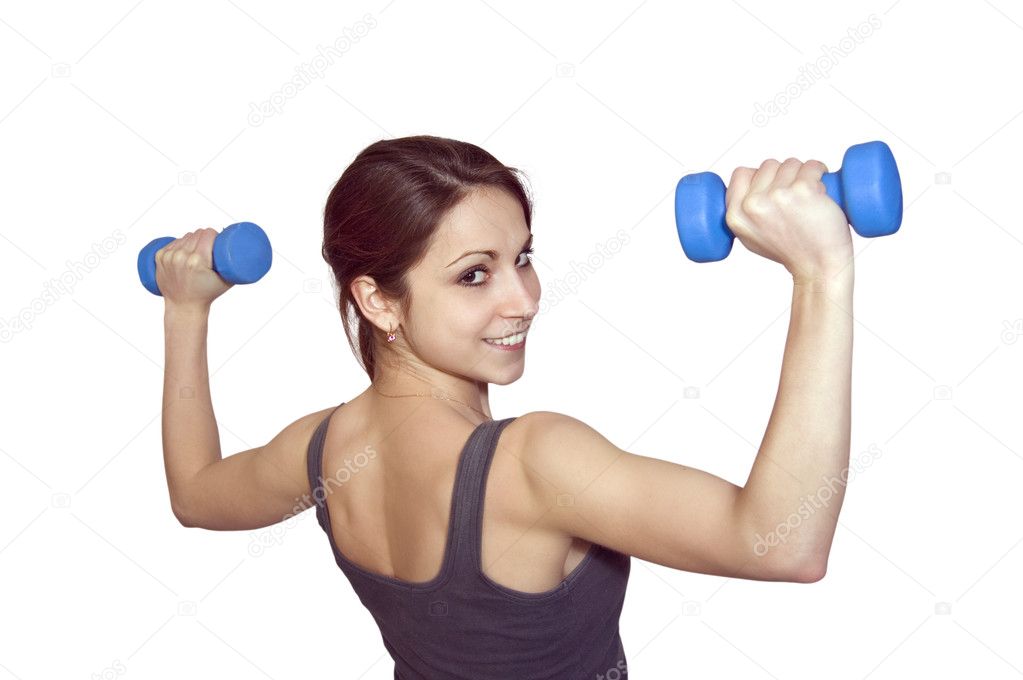 The young woman with dumbbells