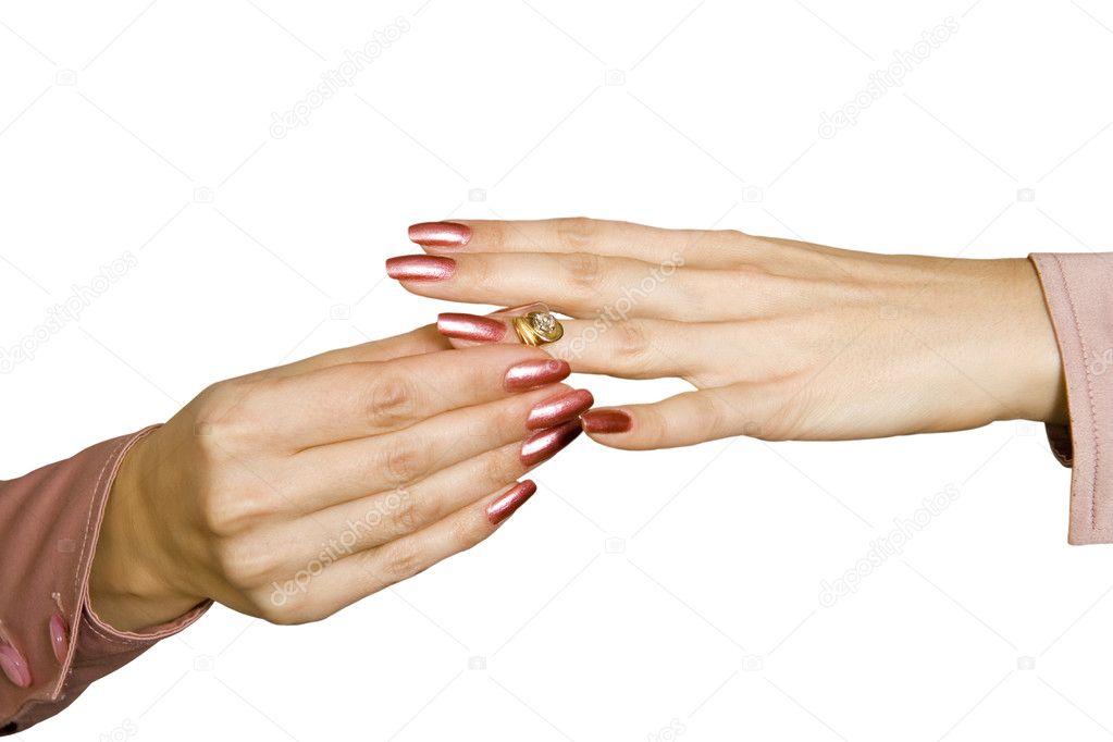 Female hands and ring with a brilliant