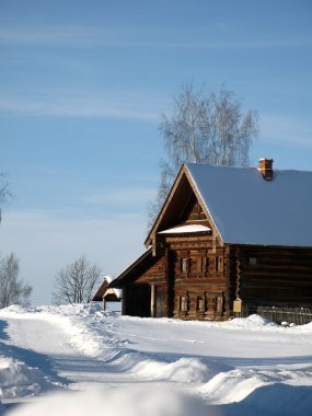 Wooden house in winter clipart