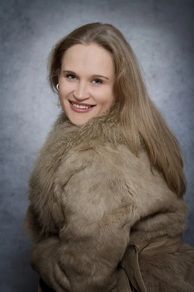 Woman dressed in fur coat
