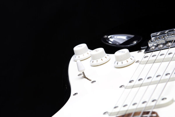Close-up of the guitar with handles VOLUME TONE knob