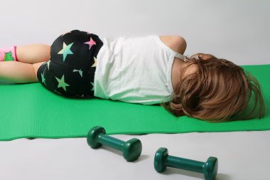 Girl is tired to make power training clipart