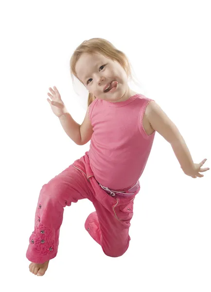 Smal girl in pink is jumping — Stock Photo, Image