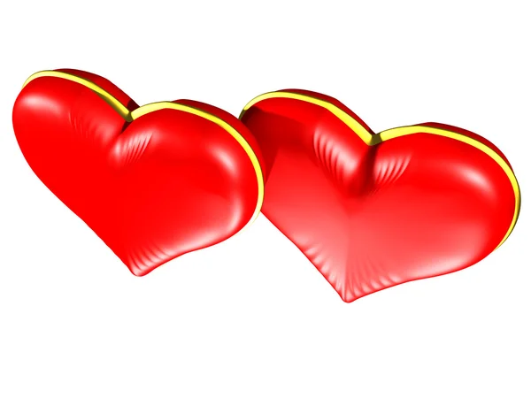 Два красных сердца с золотыми краями — стоковое фото