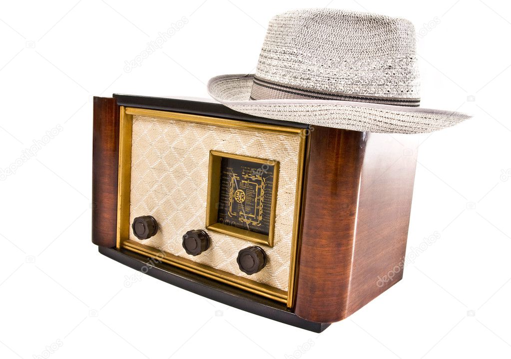Old vintage radio with a hat