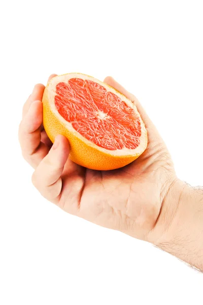 Человеческая рука держит апельсин — стоковое фото