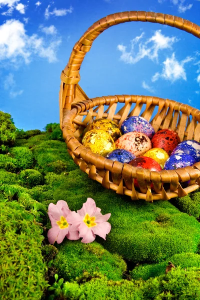 Painted Easter eggs in a basket — Stock Photo, Image