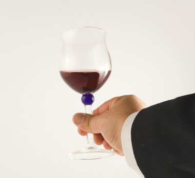 Hand with glass of wine clipart