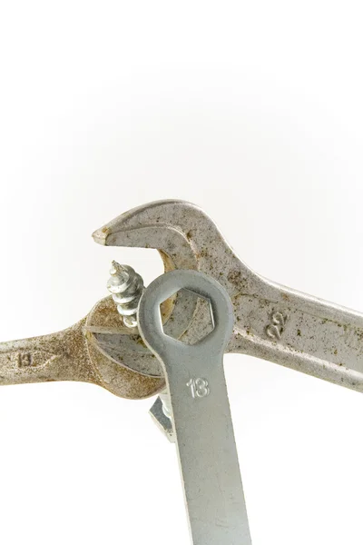 Šroub a rezavý klíč — Stock fotografie