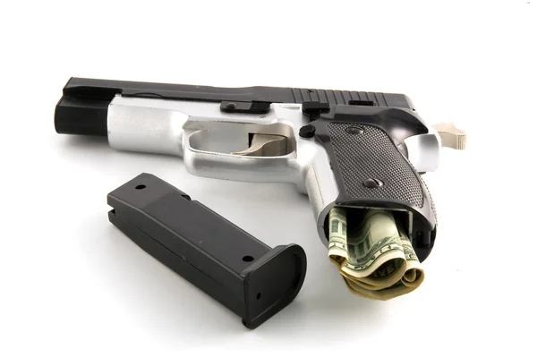 Пістолет заряджений доларами — стокове фото
