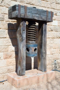 Ancient wood press for olive oil clipart