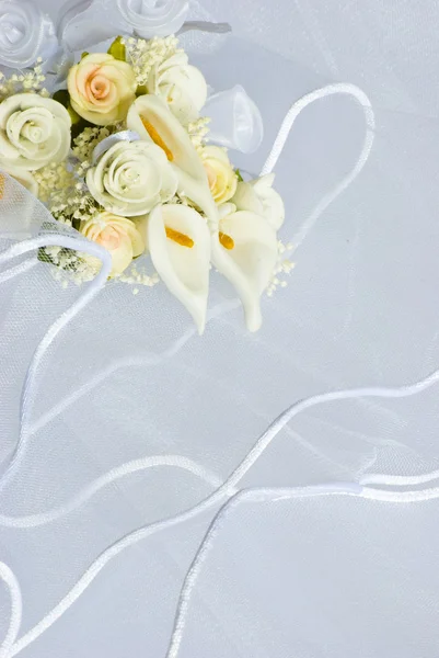 Wedding flowers over veil — Stock Photo, Image