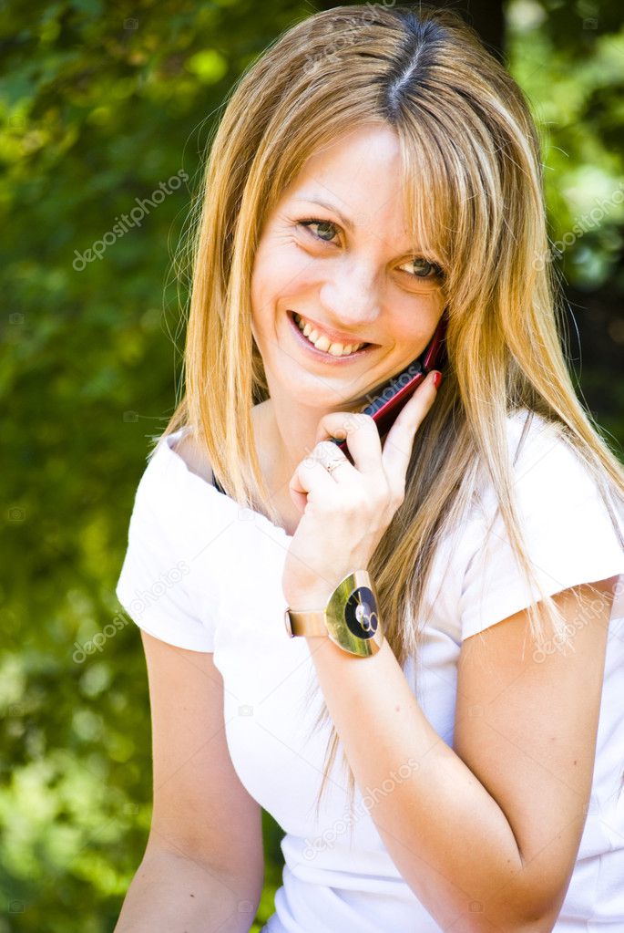 Beautiful young woman talking on phone